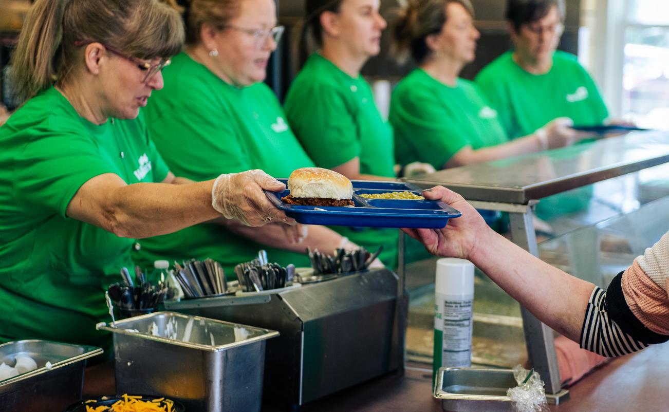 Serving at the soup kitchen